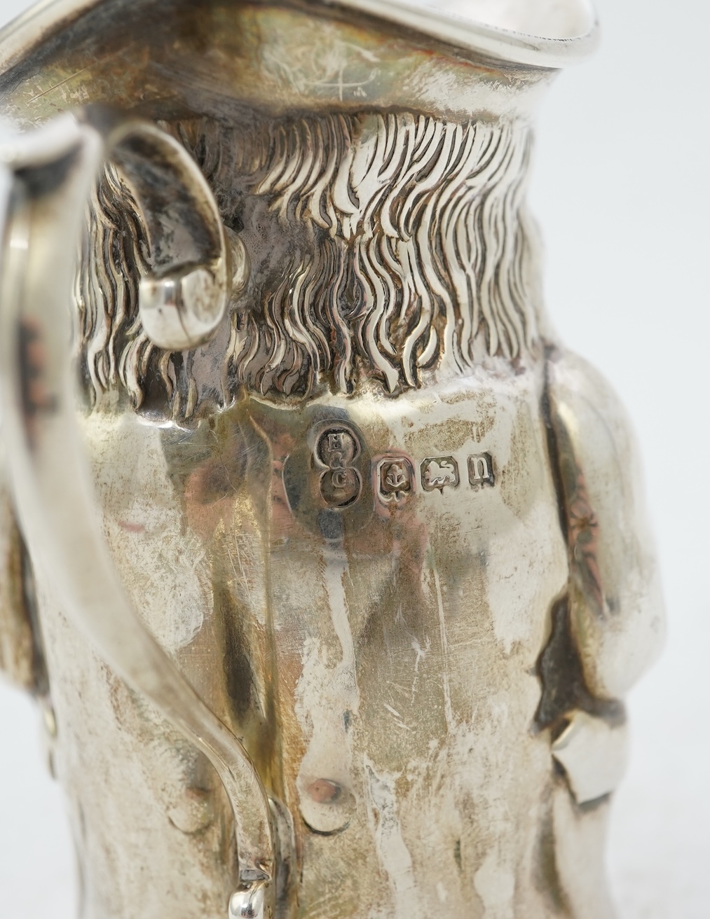 A George V novelty silver cream jug, modelled as a Toby Jug, by Hayes & Co